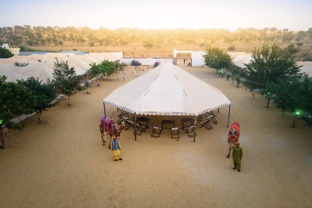 Aerial view of the desert camp and decorated camels on the sand near Sam, Jaisalmer